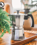 Stovetop Espresso Moka Pot For Home And Camping 6 Cup Italian Style Coffee Maker on tray surrounded by plants