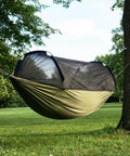 Heavy Duty Camping Hammock With Mosquito Net, 500 Lb Capacity, Portable Nylon Hanging Hammock set up between two trees