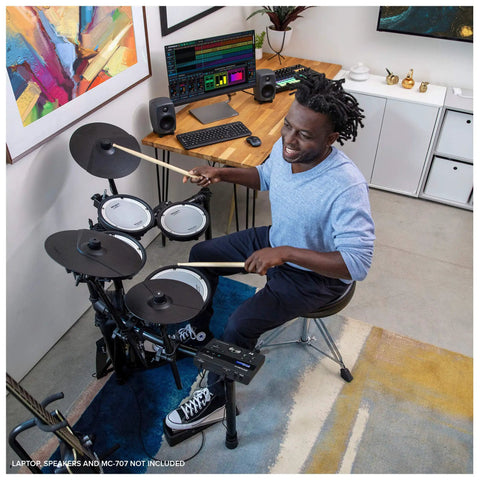 Musician playing TD-07KV Electronic V-Drums Kit With Dual-Ply Mesh Heads For Snare And Tom Pads in compact home studio