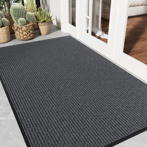 Gray Heavy Duty Front Door Mat 3 By 5 Feet Outdoor Entrance Rug with Non Slip Backing shown in an entryway setting.