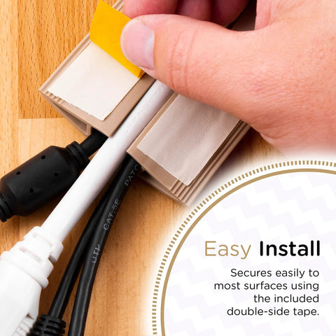 Installing 6Ft Floor Cord Cover Cable Protector for open floors with tan finish using double-sided tape, showing cavity and cables inside.