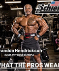 Bodybuilder in gym wearing lifting gear showcasing Schiek products.