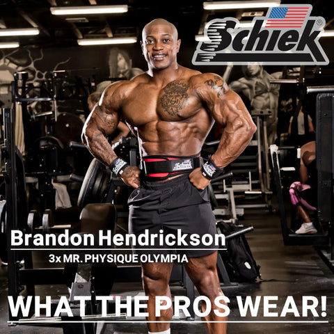 Bodybuilder in gym wearing lifting gear showcasing Schiek products.