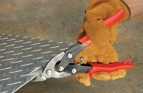 Beefy Bulldog Straight Snips Metal Cutter with spring loaded return trimming diamond plate metal in a gloved hand