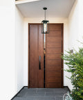 Water Hill 1 Light Outdoor Wall Sconce, modern dimmable LED waterproof lantern hanging by a wooden door on a porch