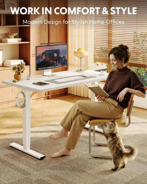 Woman reading in home office with One Piece Standing Desk 48 By 24 Inch Seamless Desktop with Electric Height Adjustment.