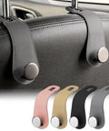 Badass Leather Car Headrest Hooks Two Pack Hella Sturdy Seat Storage Hangers For Bags And Groceries Top Shelf Ride Setup Gray showing gray leather hooks on seat with metal clips.