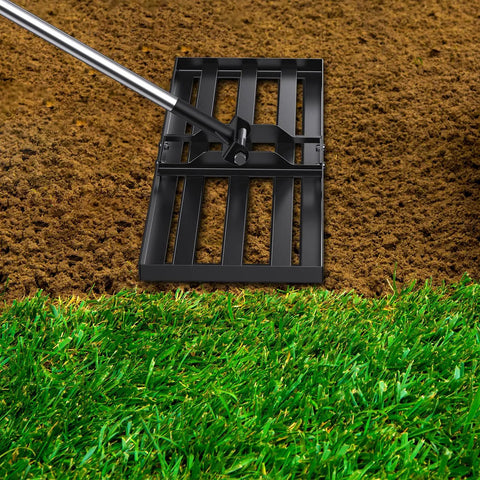 72-Inch Lawn Leveling Rake With Stainless Steel Handle leveling soil on lawn for even surface, heavy duty yard leveler in action.
