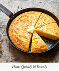Budget-Friendly Carbon Steel Frying Pan 12 Inch Pre-Seasoned with cornbread on a wooden table, showing even heating