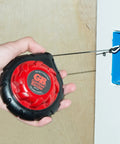 Mini Cable Snake 15 Ft Steel Fish Tape For Electrical Wiring Compact Rugged Wire Fishing Tape in use through wall opening