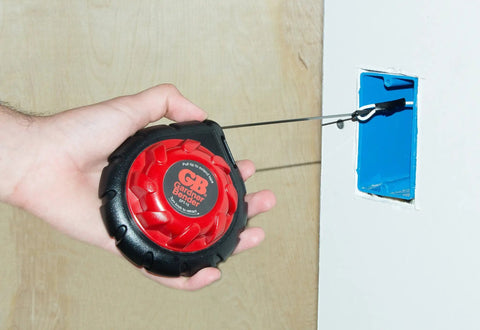 Mini Cable Snake 15 Ft Steel Fish Tape For Electrical Wiring Compact Rugged Wire Fishing Tape in use through wall opening