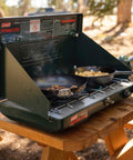 Two Burner Propane Camping Stove With 20,000 BTU Output, Wind Block Panels, And Pressure Regulator For Steady Heat in outdoor use