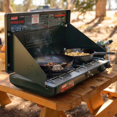 Two Burner Propane Camping Stove With 20,000 BTU Output, Wind Block Panels, And Pressure Regulator For Steady Heat in outdoor use