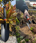 Heavy Duty Garden Trowel With Comfort Grip Oversized Aluminum Alloy Hand Shovel That Digs Through Rocky Soil Fast Rust Resistant Non Slip Handle For Quick Weeding And Planting shown in garden setting.