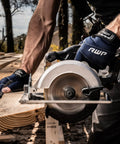 Tough As Nails Fingerless Work Gloves For Men And Women Featuring Padded Palms Rock Solid Knuckle Protection And Exposed Fingertips For Straight Up Precision Control In X Large, being used with a circular saw.