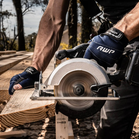 Tough As Nails Fingerless Work Gloves For Men And Women Featuring Padded Palms Rock Solid Knuckle Protection And Exposed Fingertips For Straight Up Precision Control In X Large, being used with a circular saw.