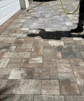 Person applying Heavy Duty Eco Friendly Paver Sealer For Brick And Concrete Low Lustre Formula on pavered driveway.