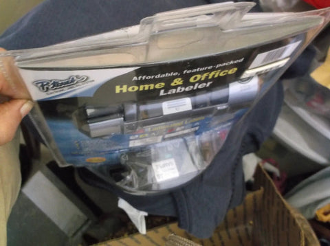 Packaging of P-Touch Label Maker Electronic Labeling System For Home Office And Outdoor Use in clear plastic bag.