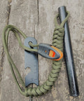 5 Inch Weatherproof Flint Ferro Rod Fire Starter Kit With Whistle And Paracord Lanyard Handle, Steel Multitool Striker on wood