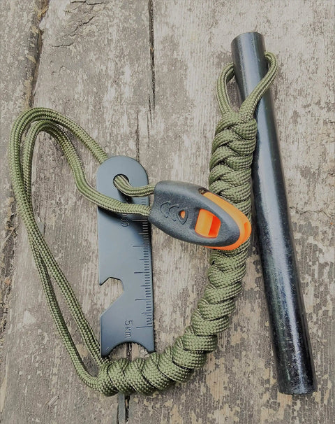 5 Inch Weatherproof Flint Ferro Rod Fire Starter Kit With Whistle And Paracord Lanyard Handle, Steel Multitool Striker on wood
