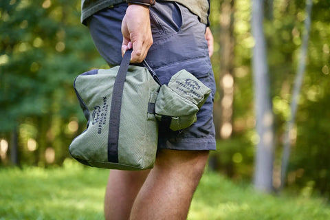 Person holding All Weather Front And Rear Shooting Bag Combo For Target Practice And Bench Rest Use Durable Olive Drab Bags