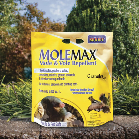Mole And Vole Repellent Granules For Lawn And Garden 10 Pound Ready To Use Outdoor Pest Control packaging on grass