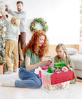 Family organizing holiday decorations from a Six Pack Heavy Duty Red Storage Bins With Secure Hinged Lids.