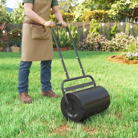 Man using 20 Inch Push And Tow Behind Lawn Roller Filled With 10 Gallons Of Water Or Sand, Heavy Duty Yard Roller For Flattening Sod And Uneven Patches In The Garden, Black.