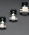 Angled front view of three 1/2-inch 304 stainless steel needle valves with BSPP female threads and knurled black knobs.