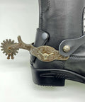 Western Cowboy Spurs With Straps Set For Men Hand Engraved German Silver Trims With Low Carbon Steel Spurs on a black boot