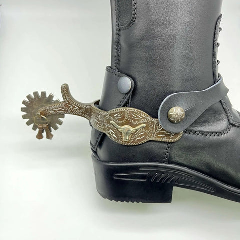 Western Cowboy Spurs With Straps Set For Men Hand Engraved German Silver Trims With Low Carbon Steel Spurs on a black boot