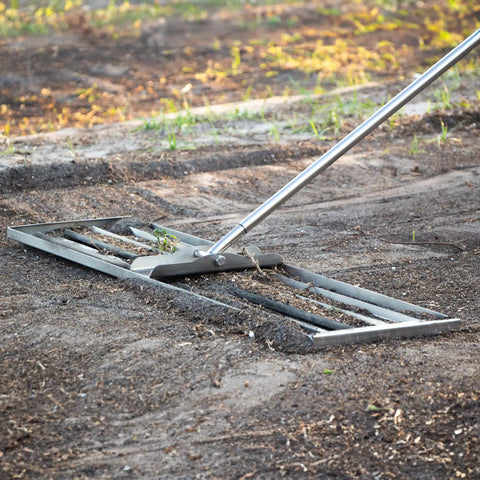 Stainless Steel 30 Inch Lawn Level Rake Pro Grade Yard Tool For Even Grass And Smooth Soil Leveling on dirt surface