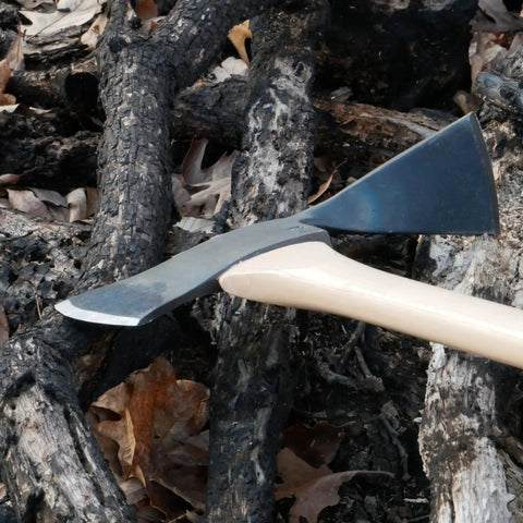 Pulaski Style Wildfire Axe With 3.75 Lb Forged Steel Head and 36 Inch Hickory Handle on charred wood