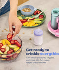 Five In One Food Prep And Storage Bowl System With Crinkle Slicing Shredding Functions, displaying crinkle-cut fruits in a glass bowl.