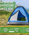 Two Person Camping Tent With Rain Fly And Carry Bag Ultralight Pop Up Shelter For Camping Essentials set up on grass near a beach.