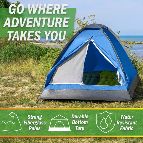 Two Person Camping Tent With Rain Fly And Carry Bag Ultralight Pop Up Shelter For Camping Essentials set up on grass near a beach.