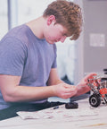 Teen building car model with Beast Mode Erector Set Metal Model Kit For Adults Teens And Advanced Kids Build Cars Planes And Excavators