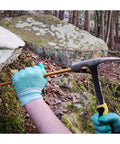 Deluxe Rockhound And Rock Mining Kit For Pros And Hobbyists 15 Piece Set hammer chiseling rock outdoors with gloves