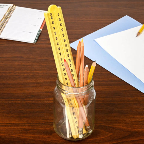 Folding Meter Stick With Inches, Centimeters, Millimeters And Meters for Quick Imperial and Metric Measurements in jar with pencils