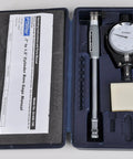 Front view of Fowler dial bore gauge set (0.7–1.5 in range) in blue case with dial gauge, probe rod, manual.