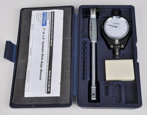 Front view of Fowler dial bore gauge set (0.7–1.5 in range) in blue case with dial gauge, probe rod, manual.