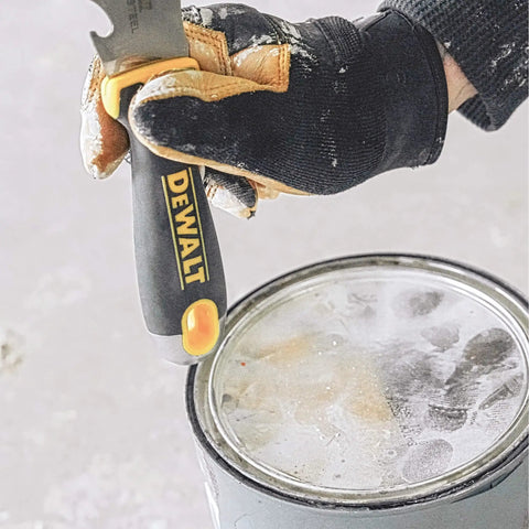 9-In-1 Painter's Tool With Straight And Curved Scrapers, Gouger, Roller Cleaner, Can Opener, Bottle Opener, Nail Puller, Screwdriver And Hammer, Carbon Steel Blade With Soft Grip Handle For Durable, Versatile Painting Jobs opening a paint can.