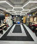 Garage interior with Plug In Hexagon LED Garage Light Kit With 8 Honeycomb Grid System, illuminating workshop space.
