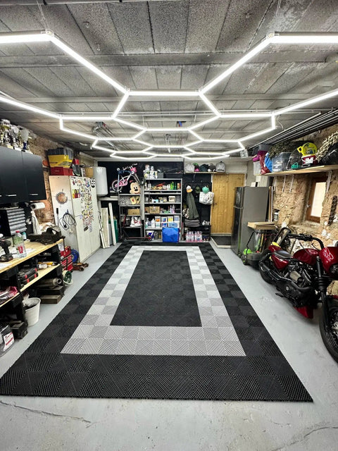 Garage interior with Plug In Hexagon LED Garage Light Kit With 8 Honeycomb Grid System, illuminating workshop space.