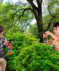 Kids having fun in the backyard using Realistic Nine Inch Fire Extinguisher Squirter Toy Pack Of Two Pump Action Water Blaster.