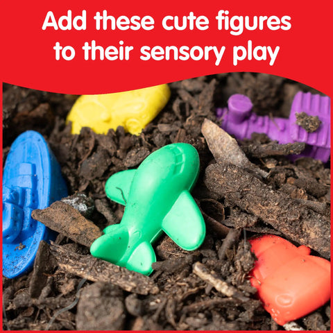 Colorful rubber transport counters for kids play, including green airplane and blue boat in sensory dirt.