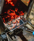 Heavy Duty Wood Stove Ash Shovel With 14.6 Inch Rust Resistant Blade, Blue Handle, scooping ashes from a wood stove