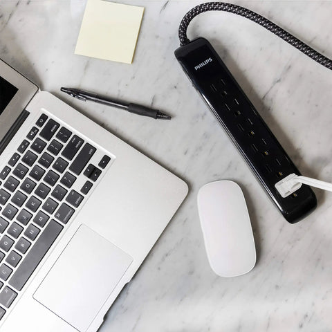Six-Outlet Surge Protector Power Strip With 10-Foot Braided Cord And Flat Plug, 1080 Joules, ETL Listed, on office desk.