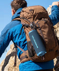 Beast 60W Portable Outdoor Bluetooth Speaker With True Wireless Stereo, IPX8 Waterproof, attached to a hiker's backpack