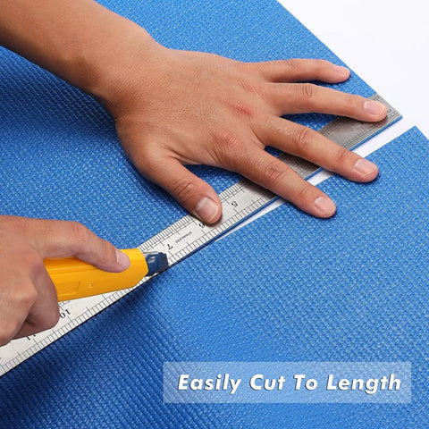 Hands cutting Blue Non Slip Foam Rubber Drawer Liner For Tool Boxes And Drawers, Easy Cut With Textured Grip, 16 Inch Wide.